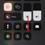 Screenshot of the Control Center on an iPhone with a red arrow pointing to the magnifying glass icon.