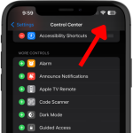 Screenshot of an iPhone with an arrow pointing to the top right corner, indicating where to swipe down to access the Control Center